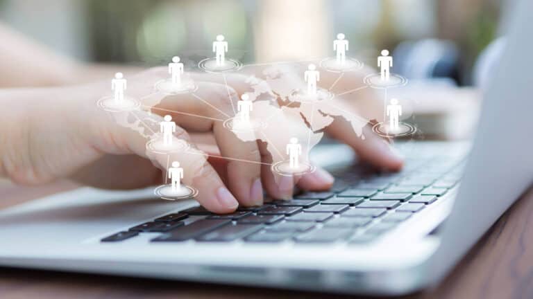 hands-with-laptop-virtual-world-map-cp-tn